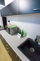 A kitchen or kitchenette at Apart Hotel GOLDEN apartments