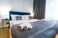 A bed or beds in a room at Apart Hotel GOLDEN apartments