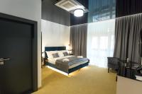 A bed or beds in a room at Apart Hotel GOLDEN apartments