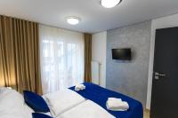 A bed or beds in a room at Apart Hotel GOLDEN apartments