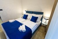 A bed or beds in a room at Apart Hotel GOLDEN apartments
