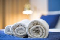 A bed or beds in a room at Apart Hotel GOLDEN apartments