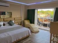 Postel nebo postele na pokoji v ubytování Sosua Inn Hotel