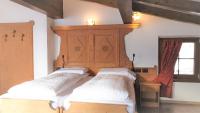 Posteľ alebo postele v izbe v ubytovaní Alpino Lodge Bivio