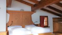 Posteľ alebo postele v izbe v ubytovaní Alpino Lodge Bivio