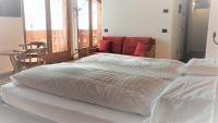 Posteľ alebo postele v izbe v ubytovaní Alpino Lodge Bivio