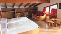 Posteľ alebo postele v izbe v ubytovaní Alpino Lodge Bivio