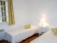 a white room with two beds and a window at Apartment Hameau la Madrague-22 by Interhome in La Madrague