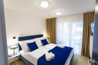 A bed or beds in a room at Apart Hotel GOLDEN apartments