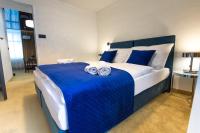 A bed or beds in a room at Apart Hotel GOLDEN apartments