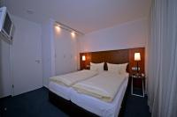 Hotel Quisisana & Appartements Quisiにあるベッド