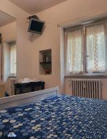 Televízia a/alebo spoločenská miestnosť v ubytovaní Ale&Andrea Apartments BLU & LILLA