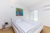 Posteľ alebo postele v izbe v ubytovaní Luxury villa Punat with pool with sea view , 50m from the beach