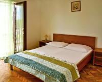 Postel nebo postele na pokoji v ubytování Apartments Iko