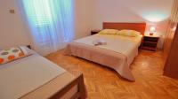 Postel nebo postele na pokoji v ubytování Apartments Iko