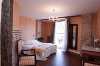 A bed or beds in a room at La Casona del Pastor