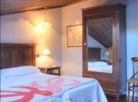 A bed or beds in a room at La Casona del Pastor
