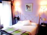 A bed or beds in a room at La Casona del Pastor