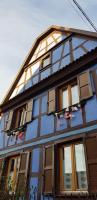 a blue house with windows with santaitures on it at maisonbleue67 in Kurtzenhouse
