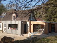 a house renovation with a shed and a building at Le Clos du Buisson in Saint-Julien-de-la-Liègue