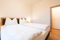 A bed or beds in a room at Fumerhof