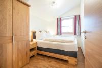 A bed or beds in a room at Fumerhof