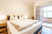 A bed or beds in a room at Fumerhof