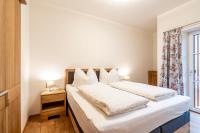 A bed or beds in a room at Fumerhof