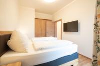 A bed or beds in a room at Fumerhof