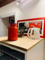a kitchen counter with a tea pot and a toaster at La maison de Nina in Sens