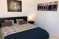 Posteľ alebo postele v izbe v ubytovaní Playa Marina Eco Bungalow – Arrieta View