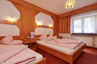Łóżko lub łóżka w pokoju w obiekcie Fremdenpension Alpenruhe