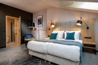 Łóżko lub łóżka w pokoju w obiekcie Hotel M29