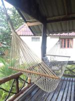 a hammock hanging from a gazebo at Malibu Beach Bungalows in Chaloklum