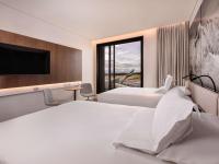 Novotel Christchurch Airportにあるベッド
