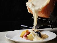 a person drizzling peanut butter onto a dessert on a plate at Keio Prelia Hotel Sapporo in Sapporo
