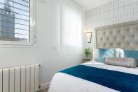 Postel nebo postele na pokoji v ubytování Genteel Home Mateos Gago
