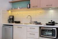 Kuchyň nebo kuchyňský kout v ubytování Iliana Apartments