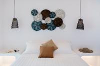 Łóżko lub łóżka w pokoju w obiekcie Zefi Hotel & Suites