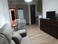 Televízia a/alebo spoločenská miestnosť v ubytovaní Apartamentos Buena Vista Bajo 1