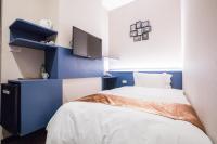 Postel nebo postele na pokoji v ubytování Travel Art Inn
