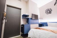 Postel nebo postele na pokoji v ubytování Travel Art Inn