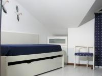 A bed or beds in a room at Appartamento - terrazzo vivibile vista mare, wi-fi gratuito