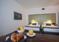 A bed or beds in a room at Hotel Buonconsiglio