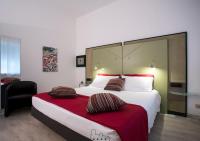 A bed or beds in a room at Hotel Buonconsiglio