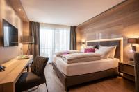 Łóżko lub łóżka w pokoju w obiekcie Hotel Adapura Wagrain