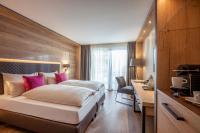 Łóżko lub łóżka w pokoju w obiekcie Hotel Adapura Wagrain
