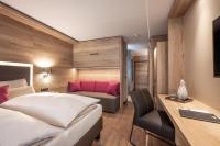 Łóżko lub łóżka w pokoju w obiekcie Hotel Adapura Wagrain