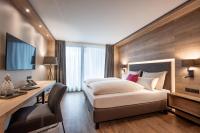 Łóżko lub łóżka w pokoju w obiekcie Hotel Adapura Wagrain