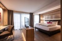 Łóżko lub łóżka w pokoju w obiekcie Hotel Adapura Wagrain